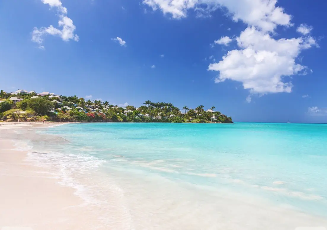Crystal clear blue waters and coconut groves on the coral beach of Saint Martin’s Island in the Bay of Bengal.